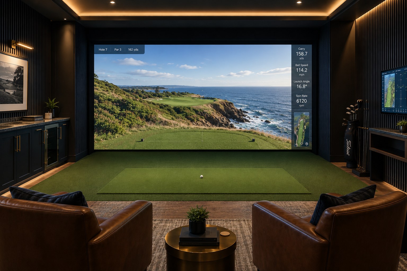 Office golf simulator lounge with impact screen showing a coastal golf hole, leather club chairs, dark slat walls and built-in cabinetry